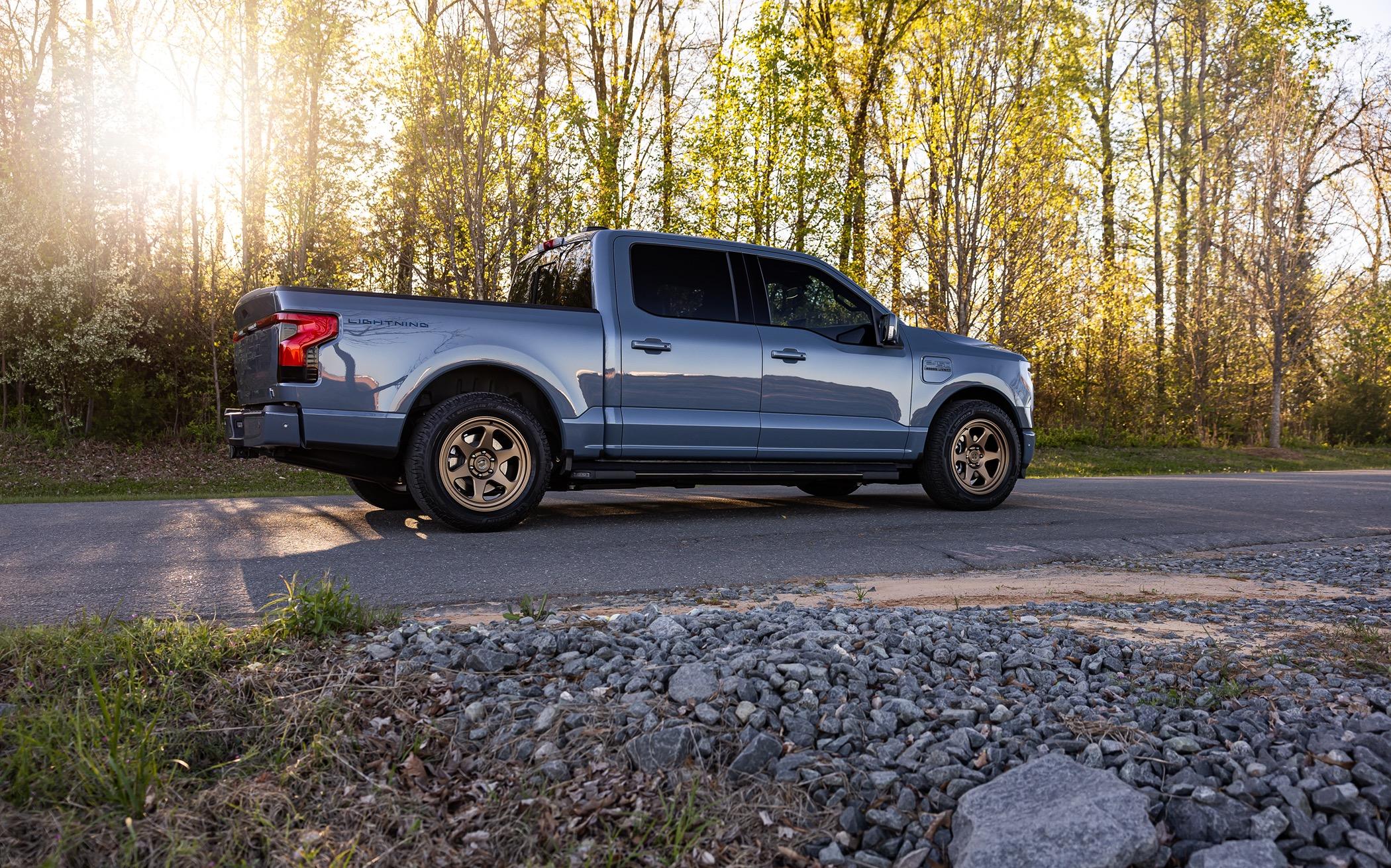 Ford F-150 Lightning Beauty shots of my Lightning. New, fully forged Trex T-200 bronze wheels, ICON stage IV lowering kit, gloss black vinyl wrapped grill, other goodies. 20240406-9j0a5043-edit