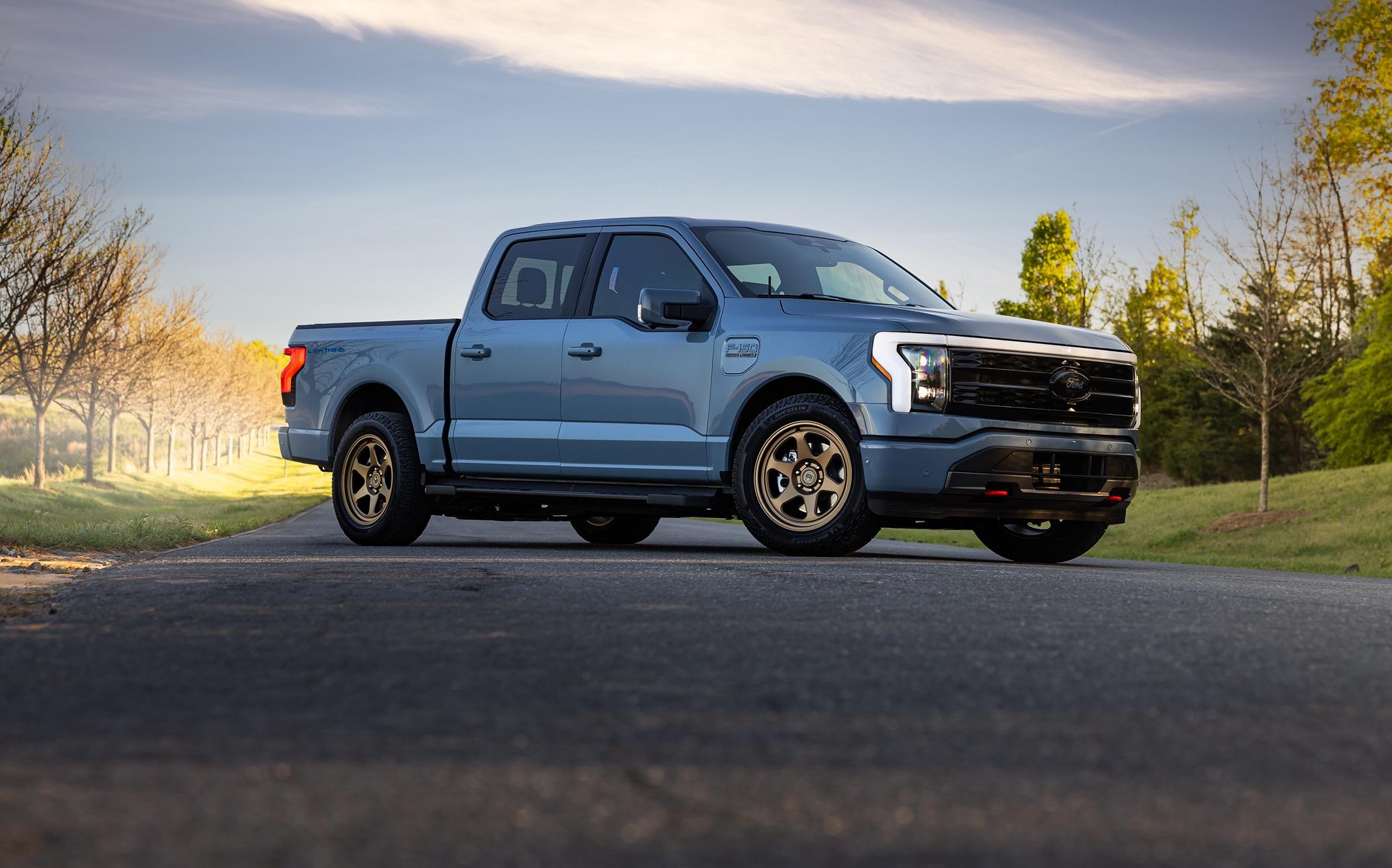 Ford F-150 Lightning Beauty shots of my Lightning. New, fully forged Trex T-200 bronze wheels, ICON stage IV lowering kit, gloss black vinyl wrapped grill, other goodies. 20240406-9j0a5064-edit