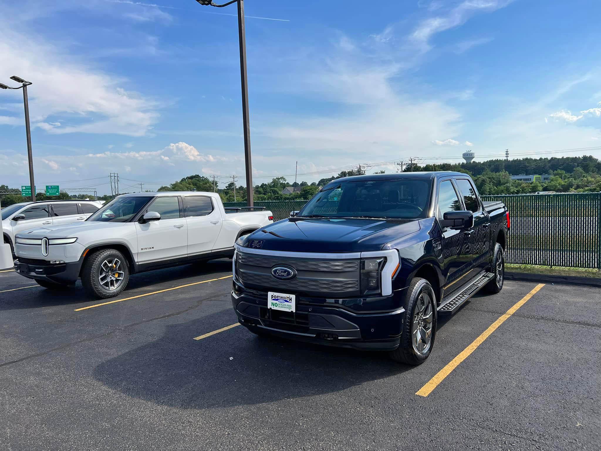 Ford F-150 Lightning Antimatter Blue Lightning vs White Rivian R1T comparison shot 291327988_8432618726763802_4189018591580731917_n