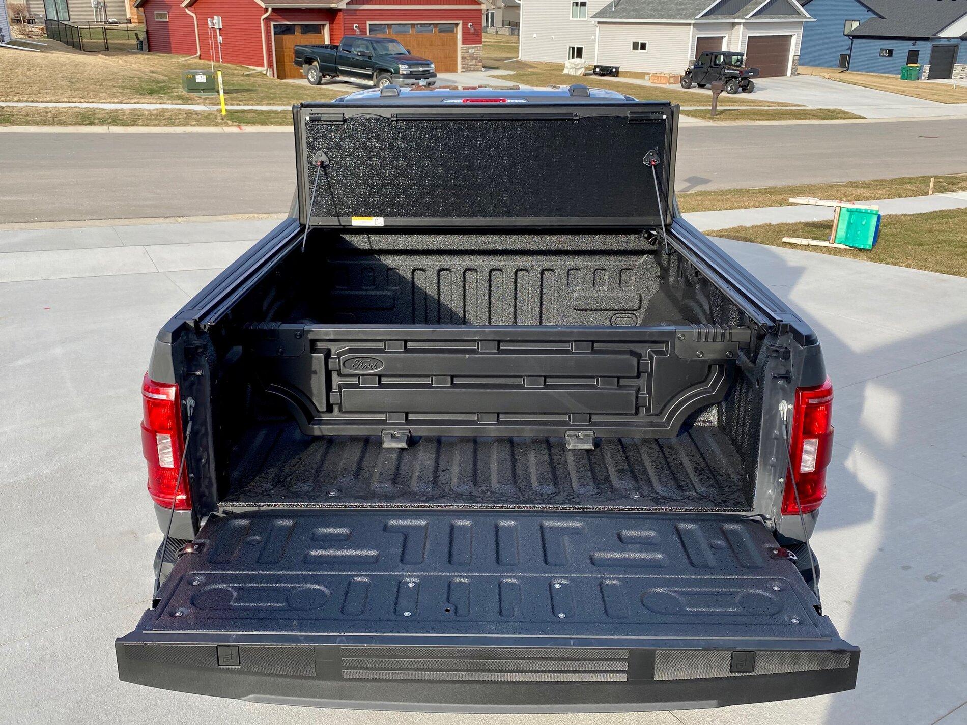 Finally got my bed setup bed liner, tonneau cover, and bed divider