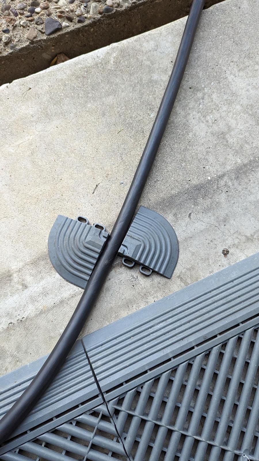 Ford F-150 Lightning Charging under the garage door, what do you use to protect the cable CABLE PROTECT