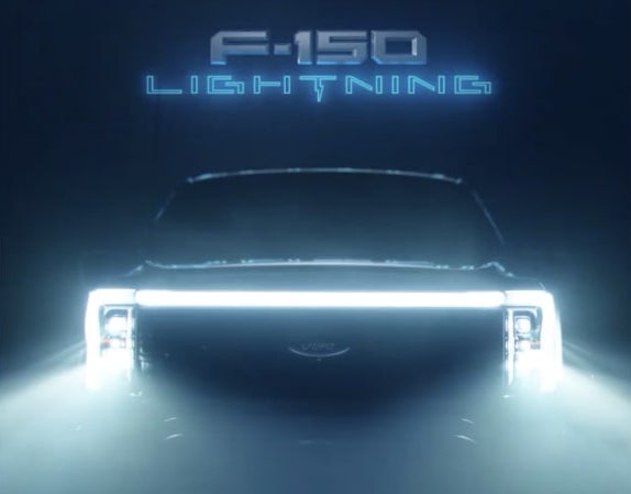 Ford F-150 Lightning Latest 2022 F-150 Lightning EV Teaser Closes In On Front Light Bar and Grille F-150-Lightning-teaser.pn