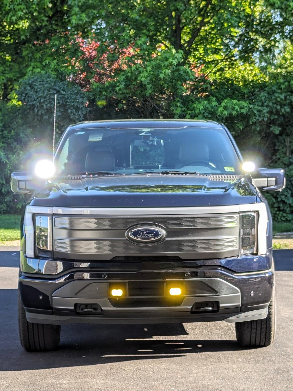 Ford F-150 Lightning Fog lights and ditch lights with backlighting, switches, and canbus integrated controls Front day all on bright portrait