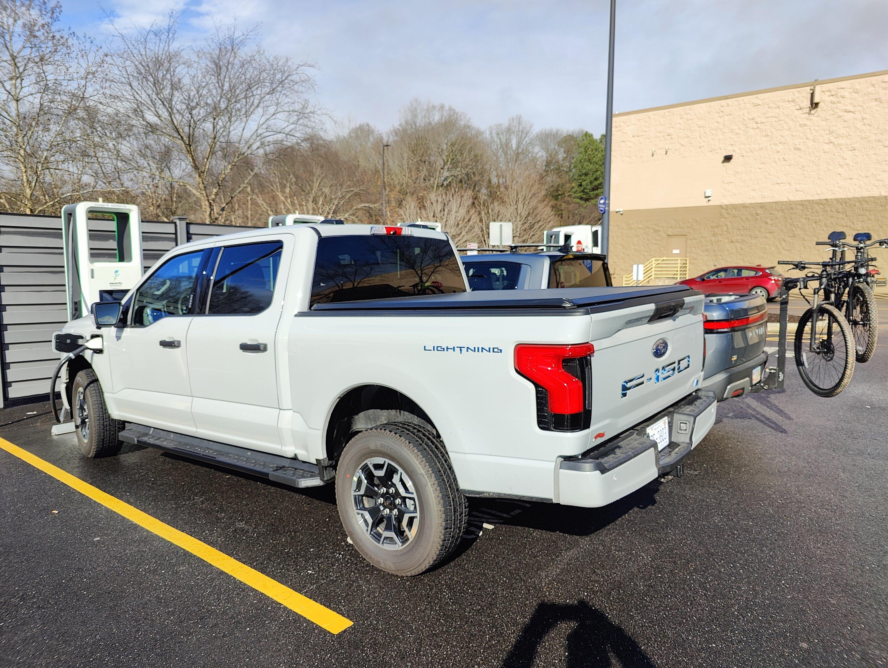 Ford F-150 Lightning Lightning pictured next to Rivian IMG20230217100634