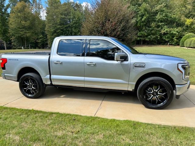 Ford F-150 Lightning Gloss black 20" wheels on my Lightning Lariat with stock AT tires, tints, AMP Power Steps IMG_0037