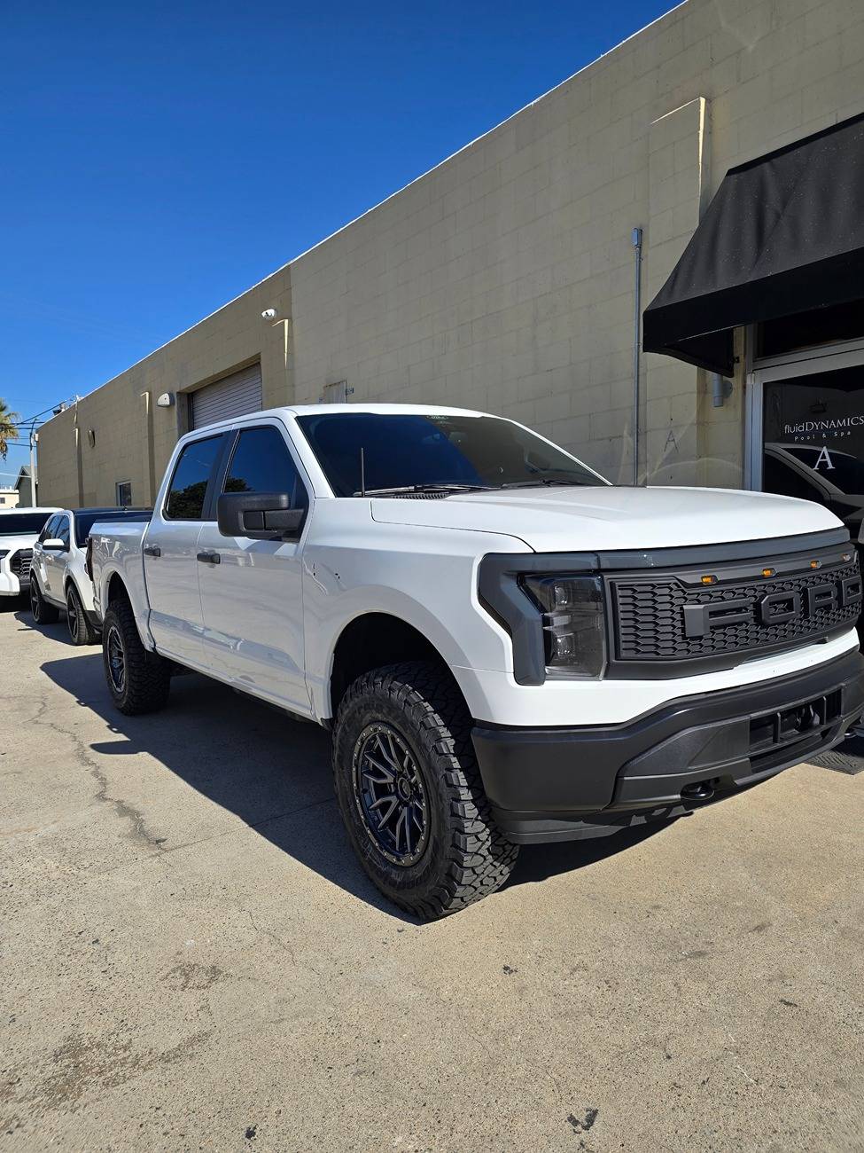 Ford F-150 Lightning 2.6" Eibach Shocks Level, 295/60R20 Recon Grappler Tires, Fuel Rebel 20x9 Wheels Resized_20241121_112505_1732217167189