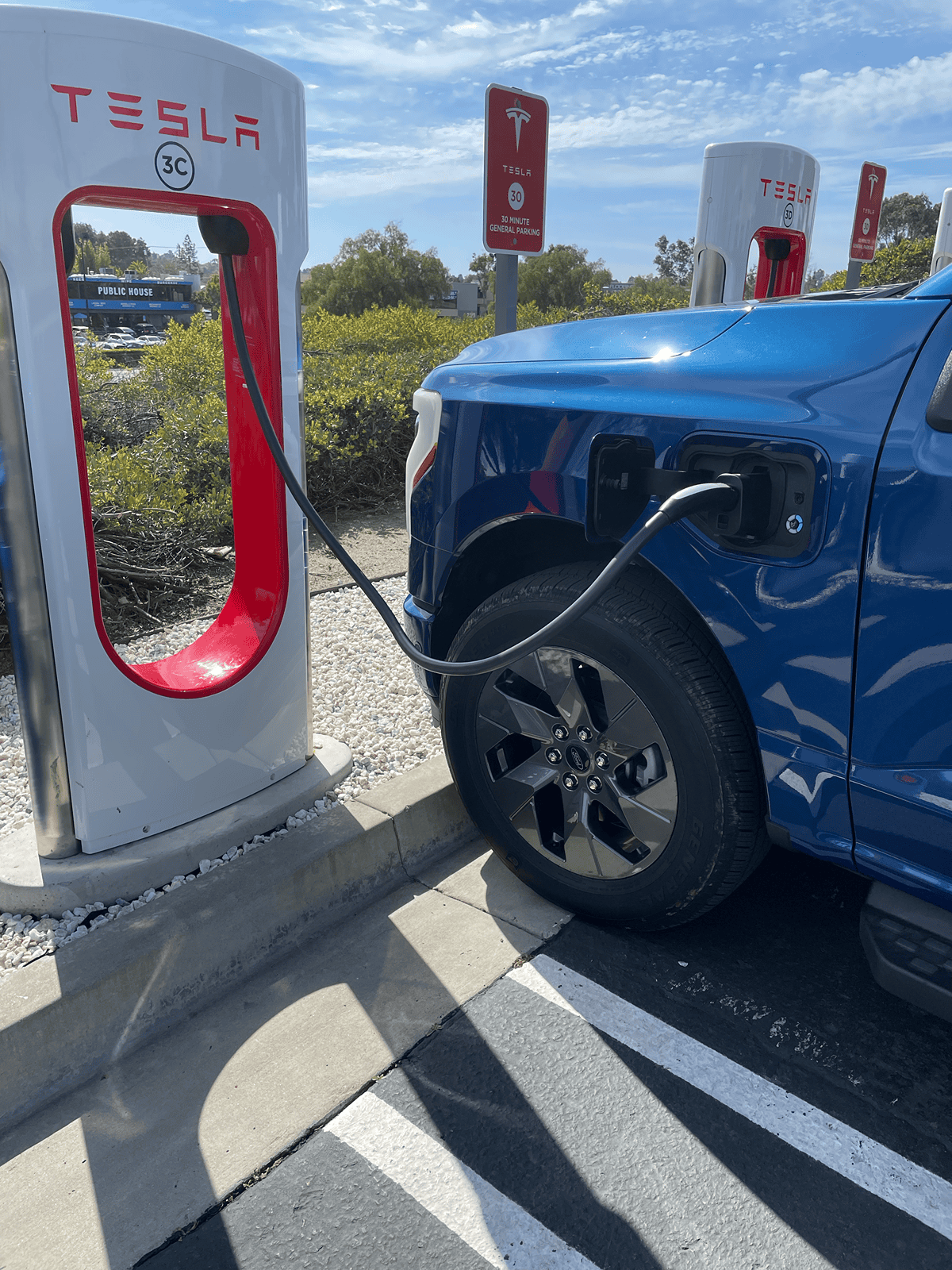 Ford F-150 Lightning Photos from new Tesla Supercharging station w/ new charger placement (for trucks) tempImageasPmb5