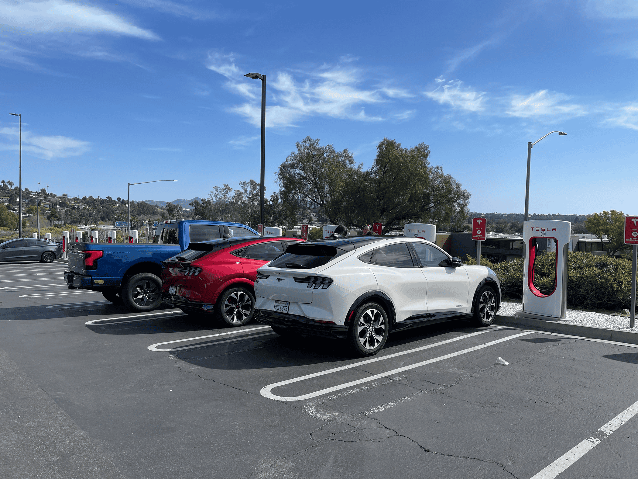 Ford F-150 Lightning Photos from new Tesla Supercharging station w/ new charger placement (for trucks) tempImagegR2JWE