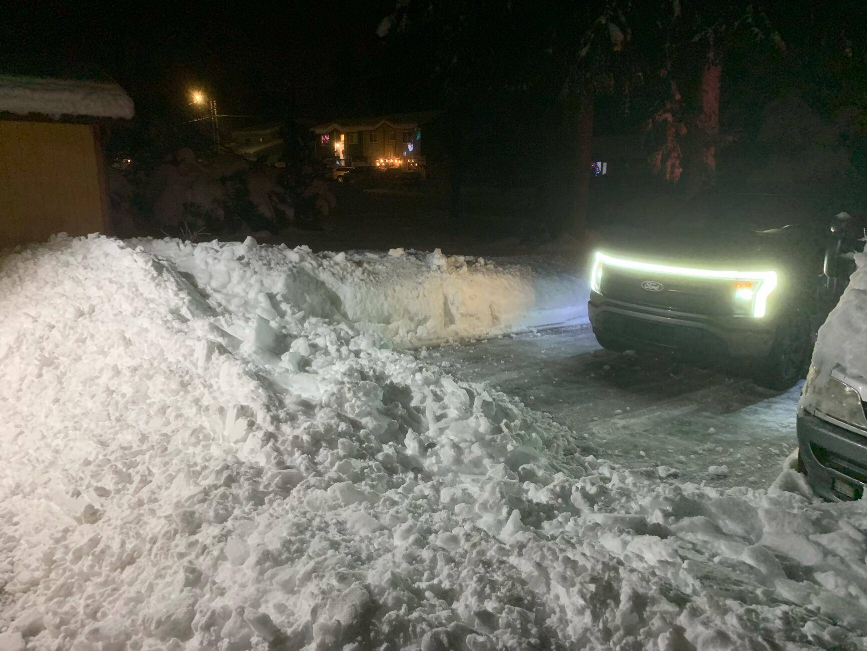 Ford F-150 Lightning Snow fell off of house roof onto driveway. tempImageHqsuKt