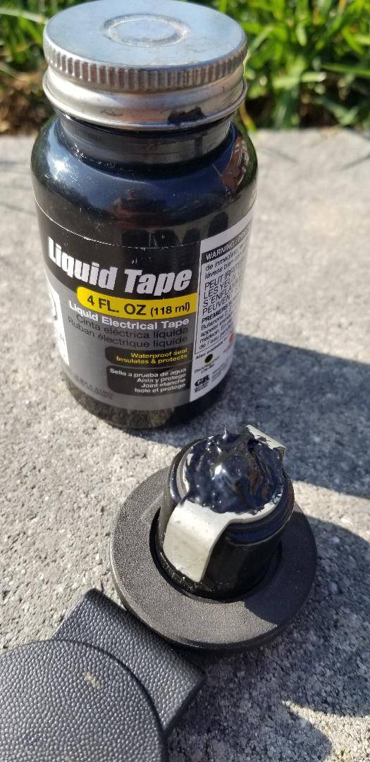 Ford F-150 Lightning Installed a new OEM lock mated to work with my truck's fob key to protect my full-use spare OEM wheel. the-underbody-end-doped-with-liquid-tape-to-co-