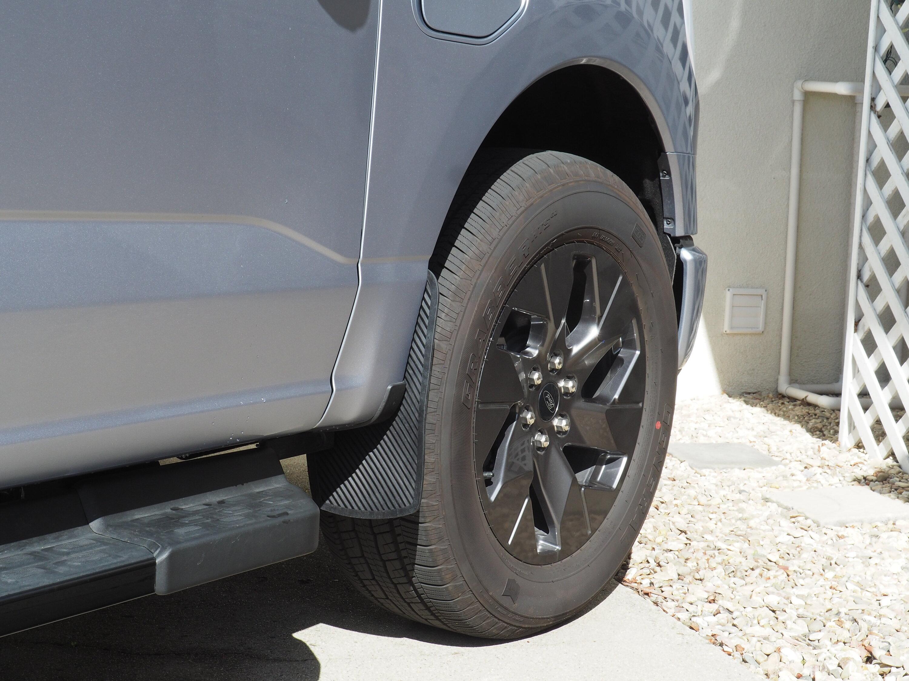 Ford F-150 Lightning Anything new in the mudflap department? W3293851 Ford F150 Lightning Xukey YS03010 flexible rubber mud flaps added in front.JPG