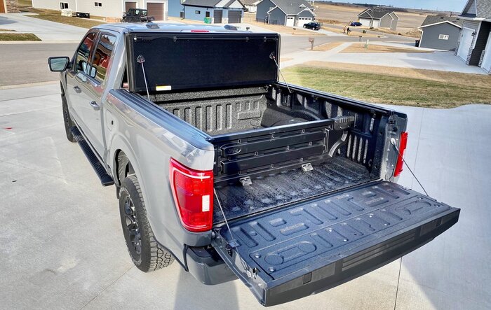 Finally got my bed setup: bed liner, tonneau cover, and bed divider.